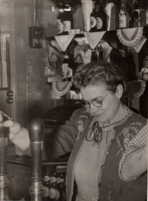 Beatrice Eyres serving a pint at at the Kings Arms, 67 Old Bethnal Green Road - pre 1954.
