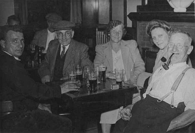 In "the Morpeth" - Late 1950s, on right with pipe in mouth, my grandfather; George James Moore. The two other men are his youngest and oldest brothers, all men were; blacksmiths, coachbody builders, wheelwrights, and farriers.