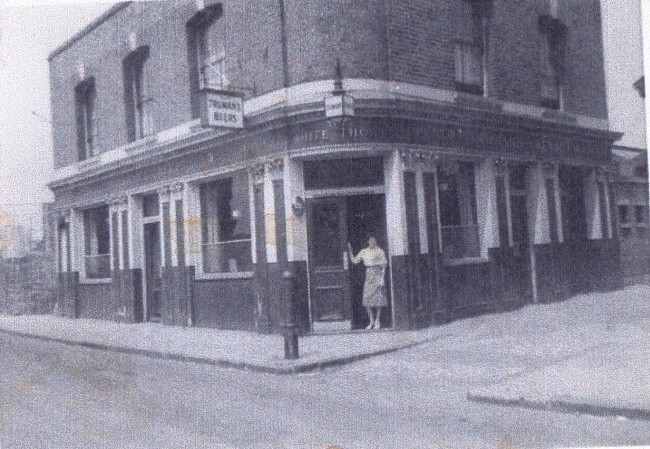 Whitethorn, 30 Whitethorn Street, Bow E3 with Hannah Ervin standing in the doorway around 1954-58.