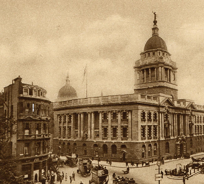 The photograph is taken from St Sepulchre's Church, looking south east. Viaduct Tavern on the left, and also showing St Paul's and the Old Bailey.