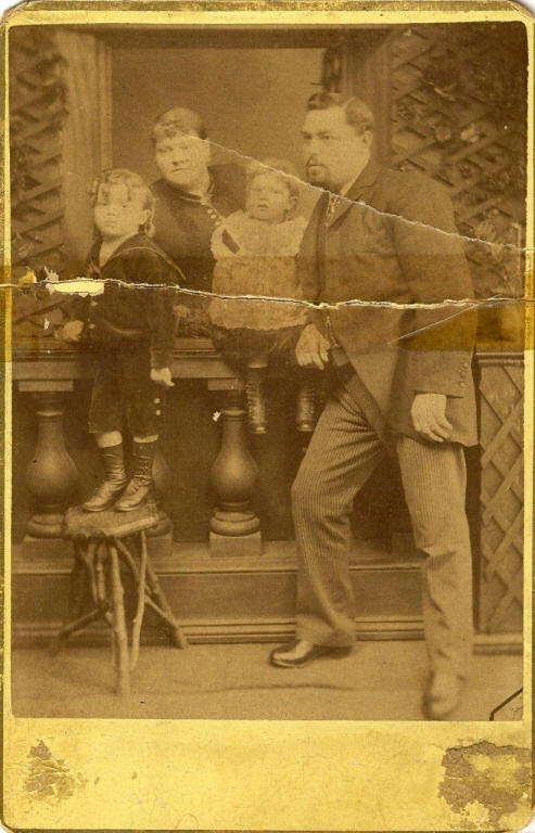 This is a photo of my Grandmother Isabel Adams (the little girl), her brother Charles William Robert Adams and my Great Grandparents Charles Robert Adams and Isabel (nee Hinchliff) Adams.