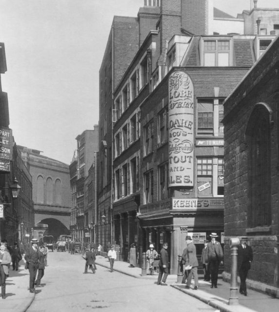 Globe, Crutched Friars at the corner of Seething Lane looking north up Crutched Friars, on 20.6.1912. The landlord is Percival Charles Keene. St Olaves church is on the right.