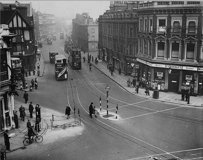 Mother Red Cap (right) and Halfway House (left), looking up Camden Road.. - circa 1935